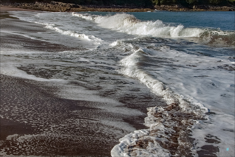 Waves on red sand