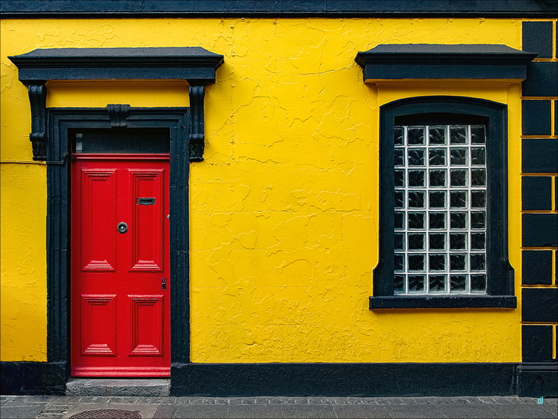 The yellow house with red door